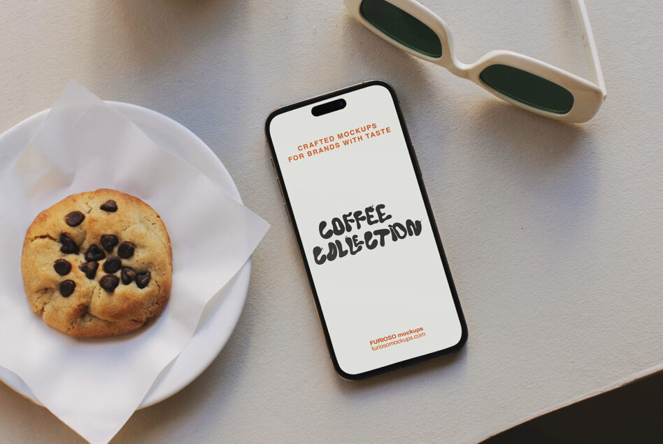 iPhone mockup centered with cookie on white plate, latte cup, sunglasses nearby