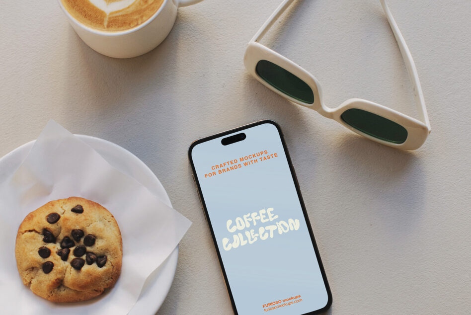 Minimalist flatlay with iPhone mockup, latte cup, chocolate chip cookie, cream sunglasses