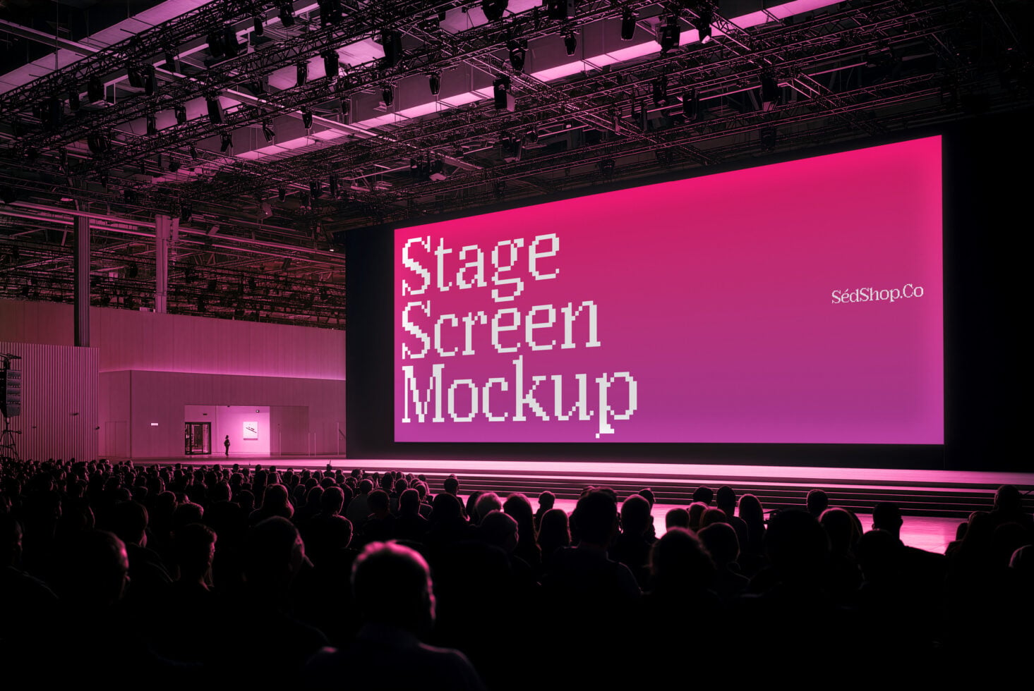Massive LED stage screen with pixel font text glowing hot pink in dark venue filled with crowd