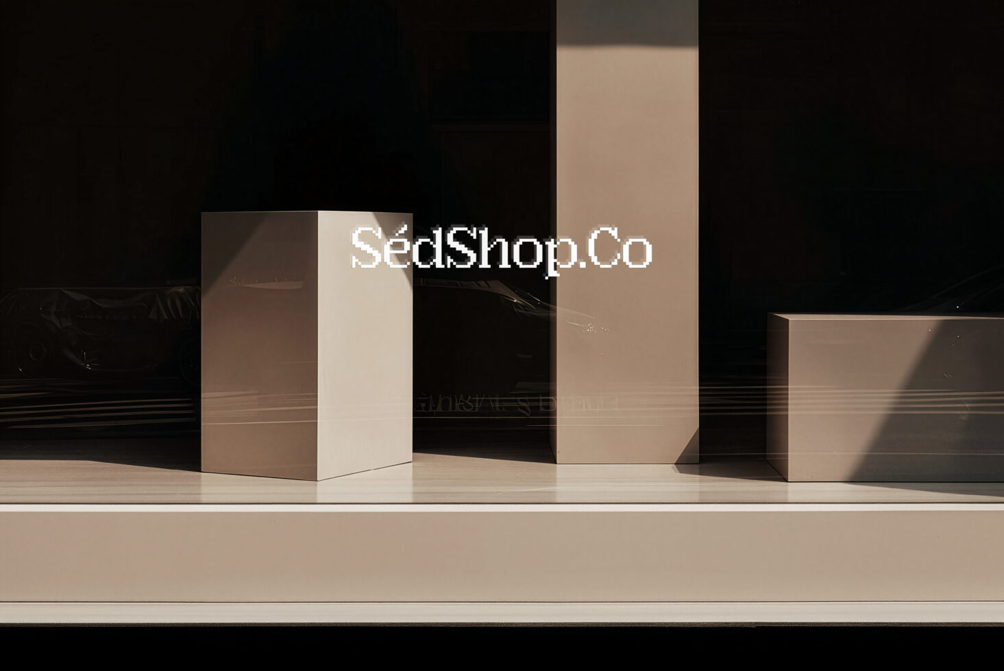 Minimalist product boxes mockup with beige, cream, plus black backdrop with dramatic lighting