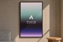 Framed poster on concrete wall showing gradient from pink to purple with Mockup Lab logo in center