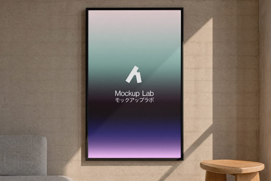 Framed poster on concrete wall showing gradient from pink to purple with Mockup Lab logo in center