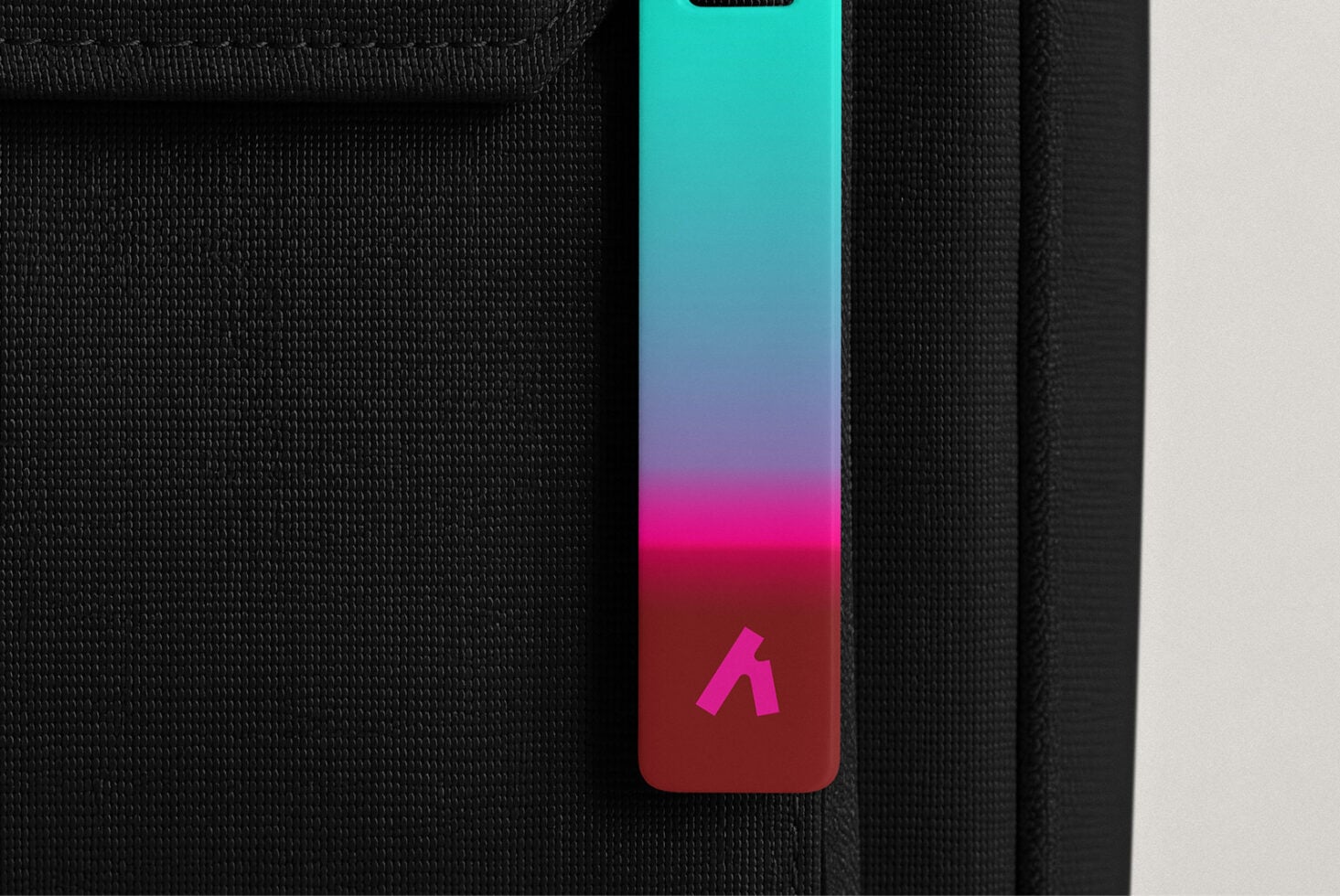 iPhone case mockup with vibrant gradient from cyan to magenta on textured fabric background