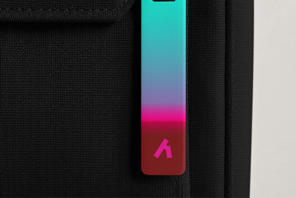 iPhone case mockup with vibrant gradient from cyan to magenta on textured fabric background