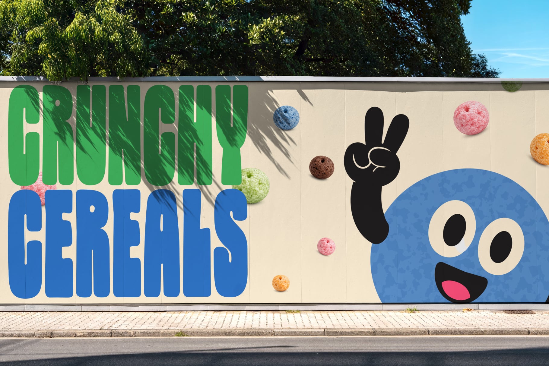 Colorful street mural with bold green blue typography, playful character, scattered donut props