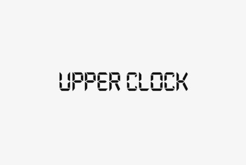 Bold geometric font with sharp cutout letterforms on light background