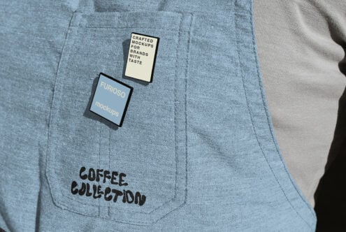 Two clothing hang tags on blue fabric with Coffee Collection text visible below