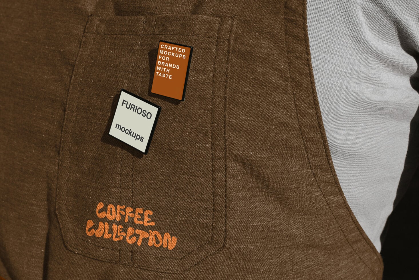 Two label mockups on brown fabric with orange, cream, plus white sleeve visible