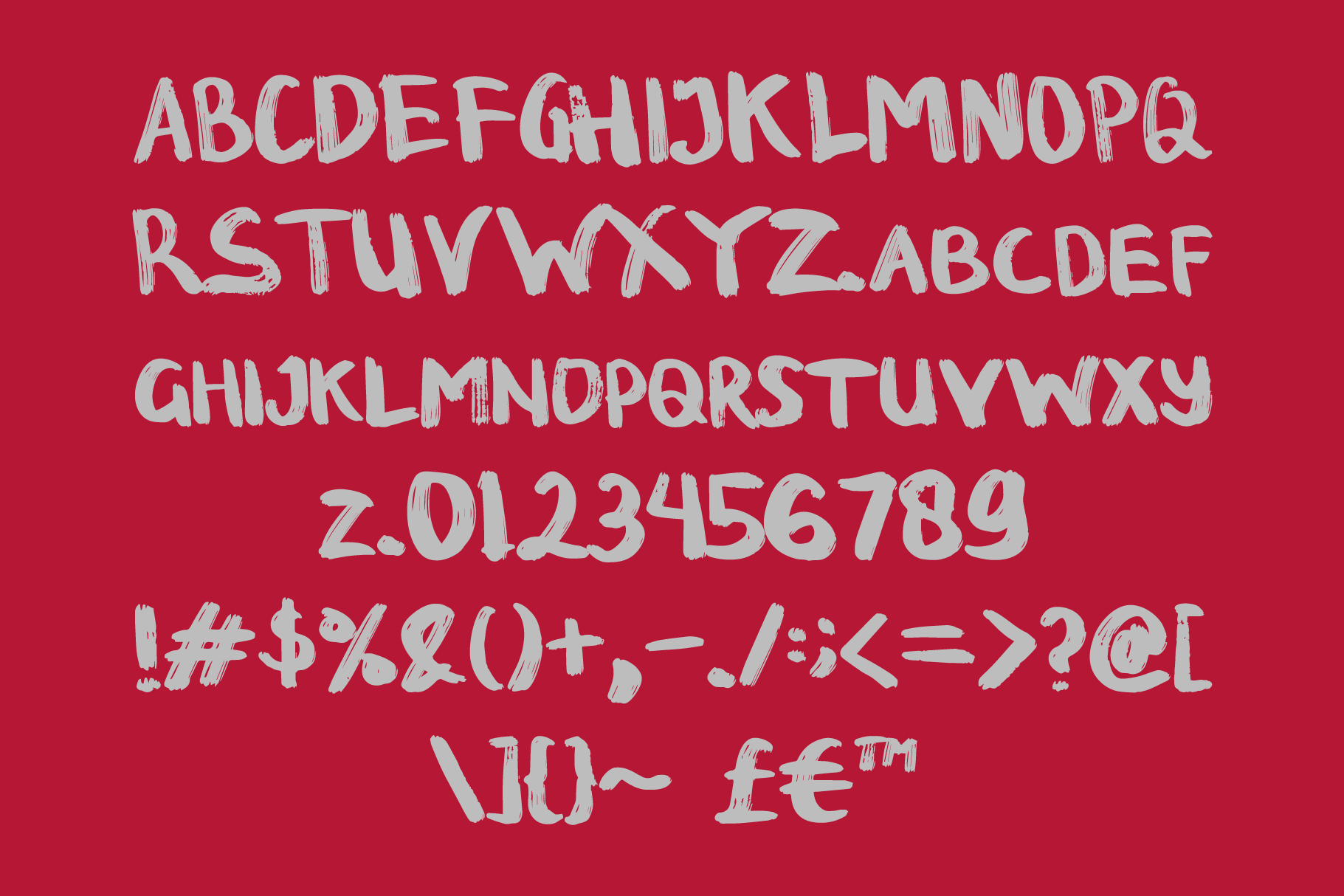 Rough brushed sans typeface with full character set on deep red background