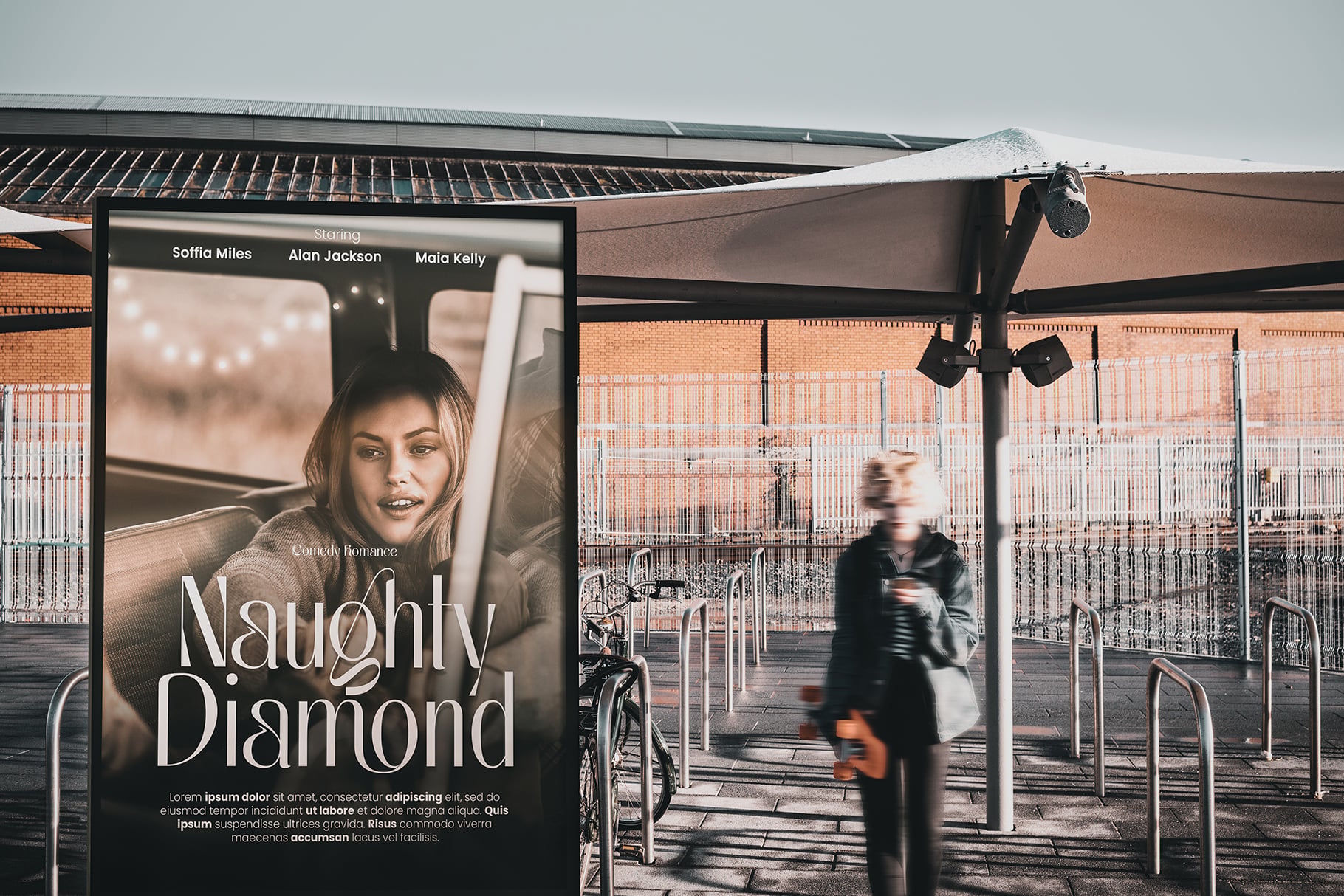 Movie poster mockup on urban transit shelter with cyclist passing by
