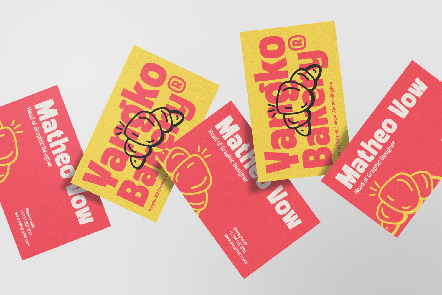 Colorful business card mockup with bright yellow, red cards displaying playful character illustrations