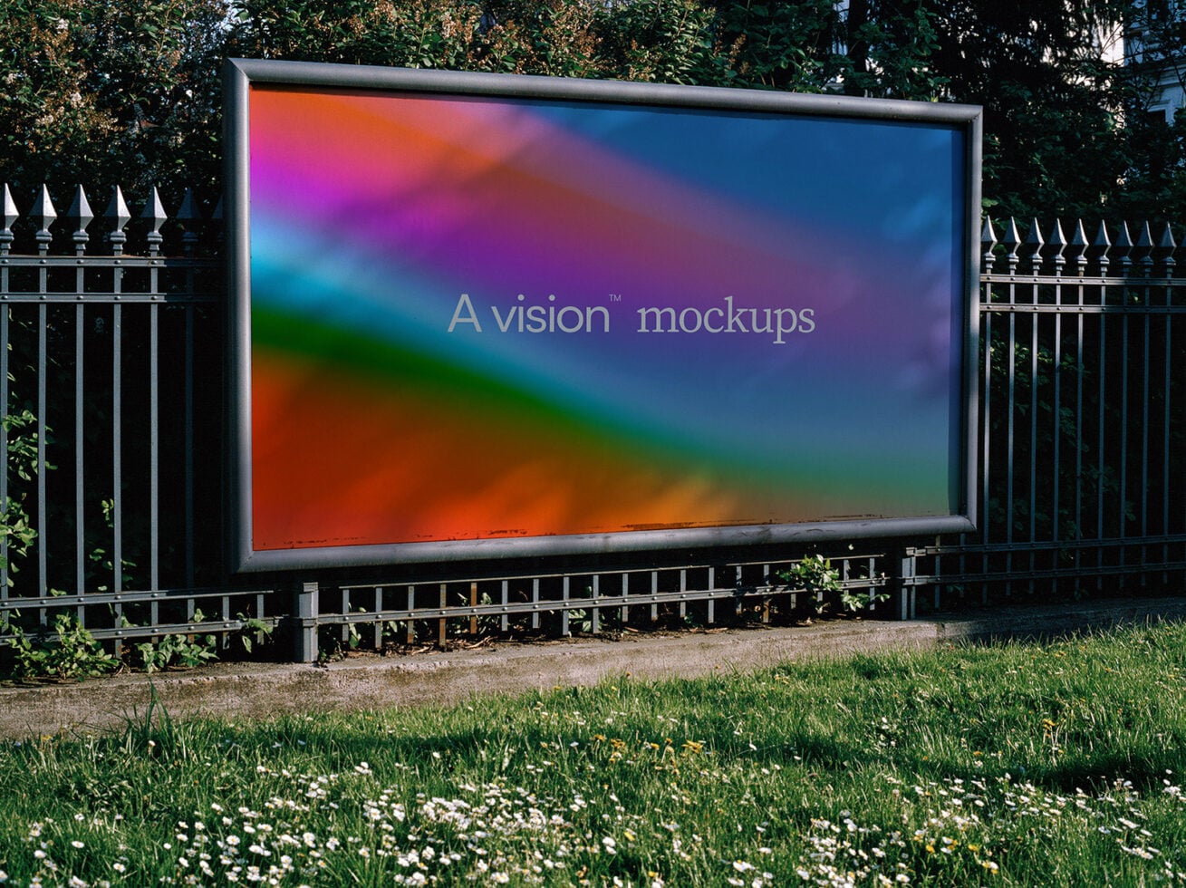 Outdoor billboard mockup with vibrant gradient display surrounded by black fence with ivy