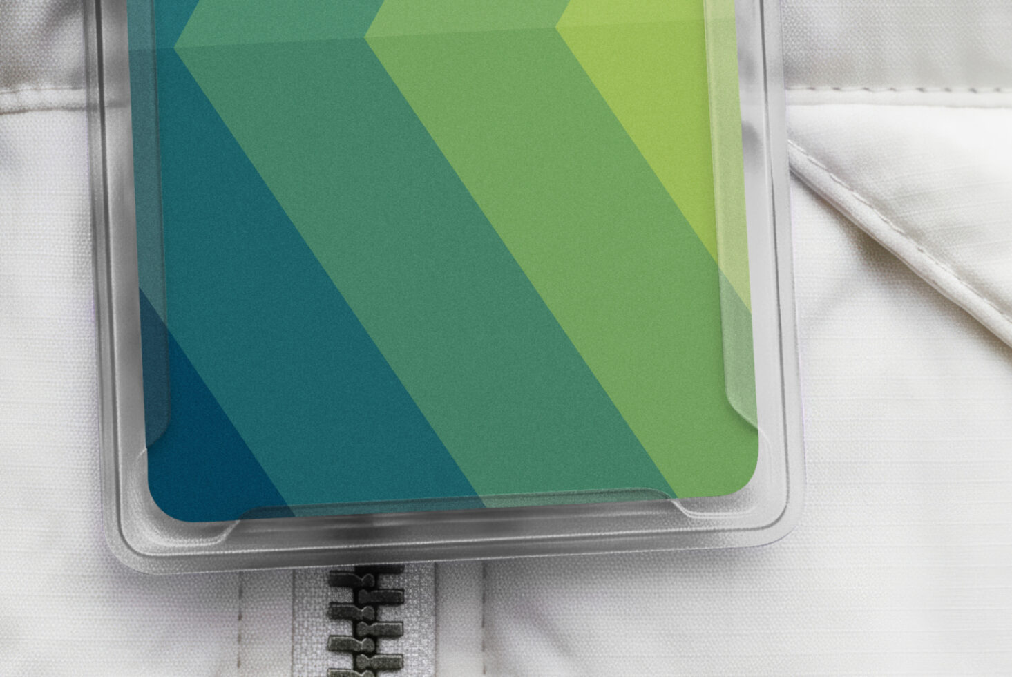 Transparent phone case mockup with teal to lime gradient chevron pattern on white fabric background