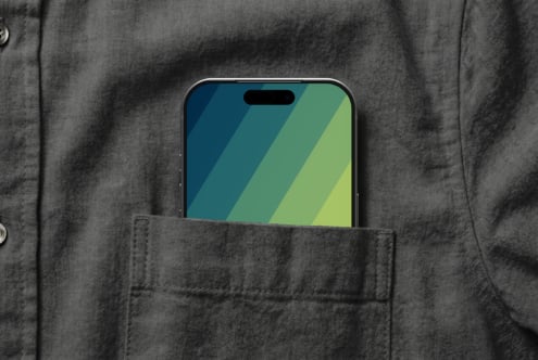 iPhone mockup in shirt pocket showing colorful gradient wallpaper display