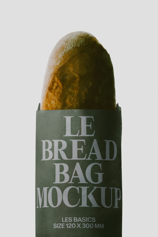 Bread bag mockup showing crusty baguette in sage green wrapper with serif typography
