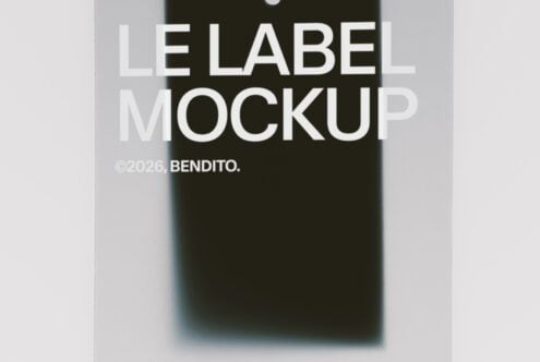 Minimalist label mockup with bold white typography overlaid on dark fabric swatch with soft shadow blur