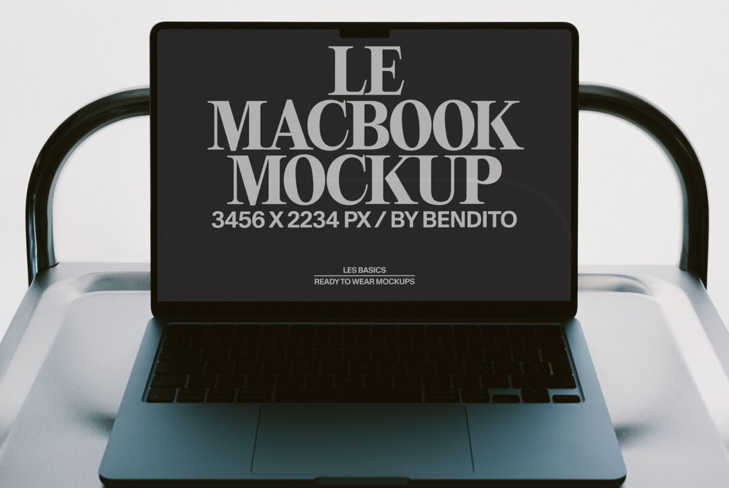 MacBook laptop mockup showing screen display in silver with dark background setup
