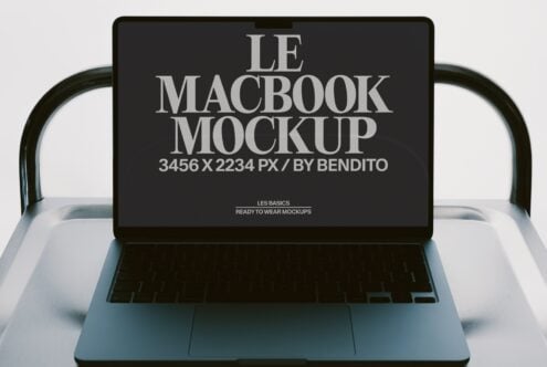 MacBook laptop mockup showing screen display in silver with dark background setup