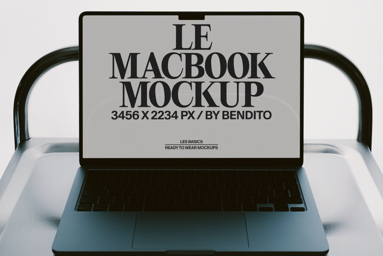 MacBook mockup with serif typography on screen, ready to swap your designs in