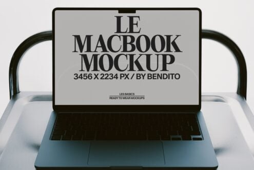 MacBook mockup with serif typography on screen, ready to swap your designs in