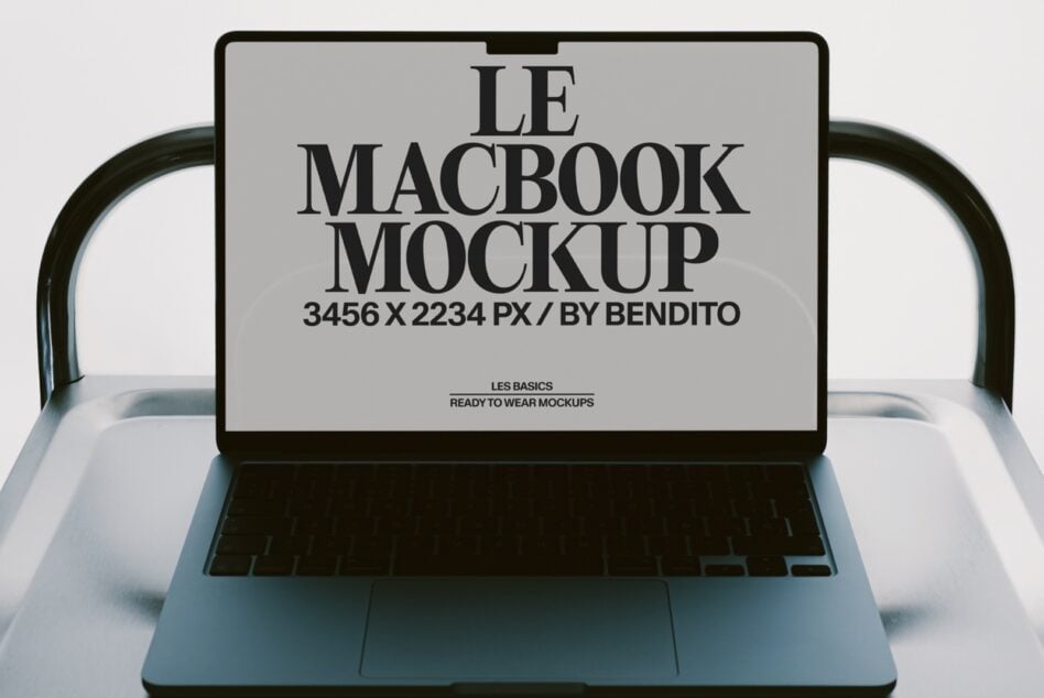 MacBook mockup with serif typography on screen, ready to swap your designs in