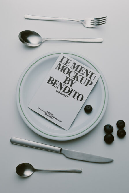 Menu mockup styled flat lay with plate, silverware, olives, minimalist food photography setup