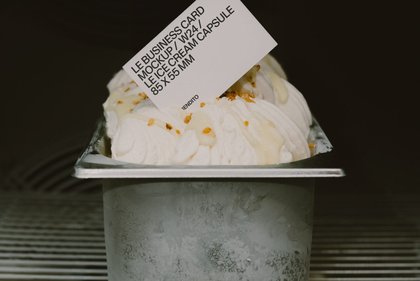 Le business card mockup 2w24 on concrete ice cream cup with gold flakes