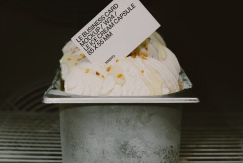 Le business card mockup 2w24 on concrete ice cream cup with gold flakes