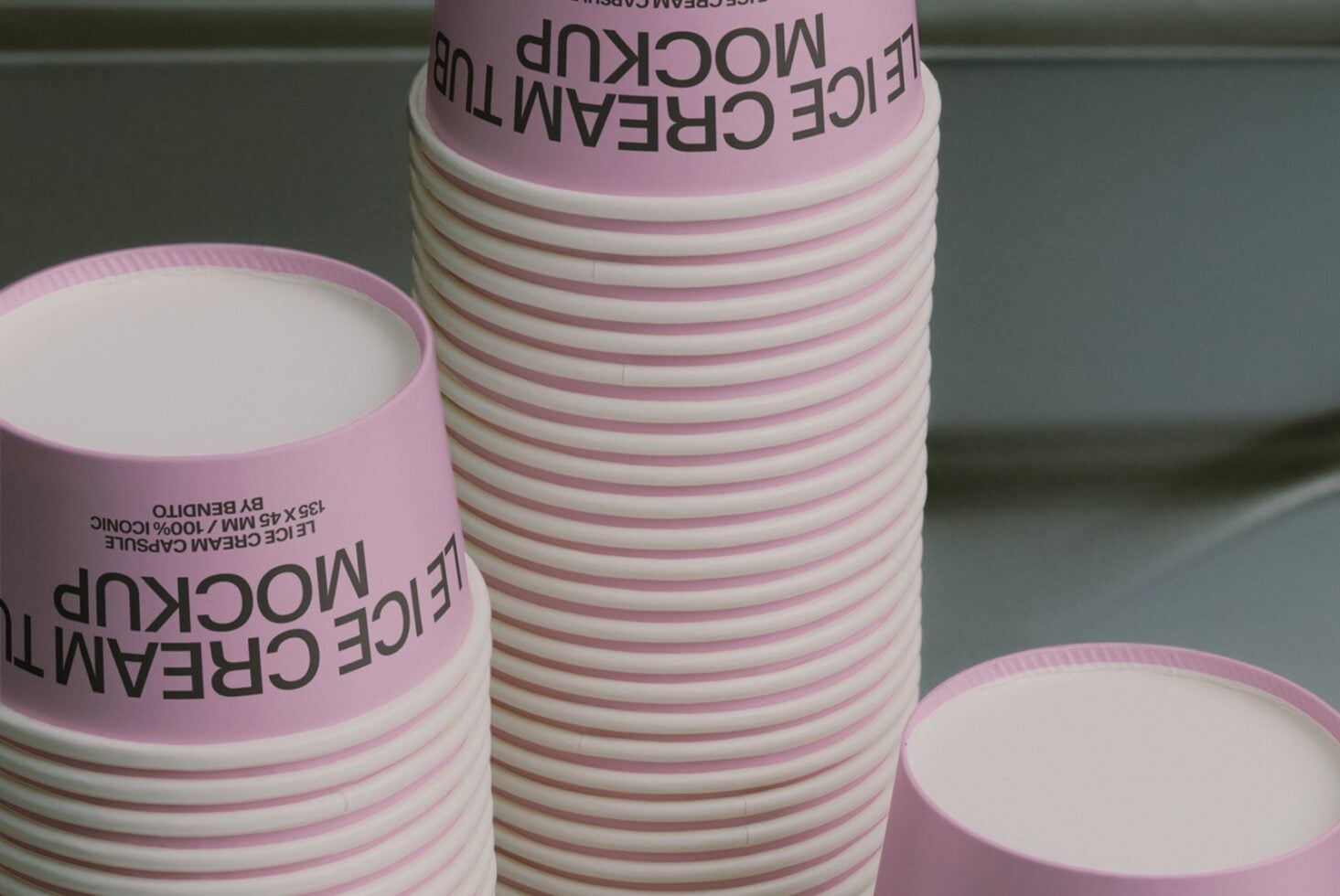Stacked pink paper cups with black text mockup showing product branding options