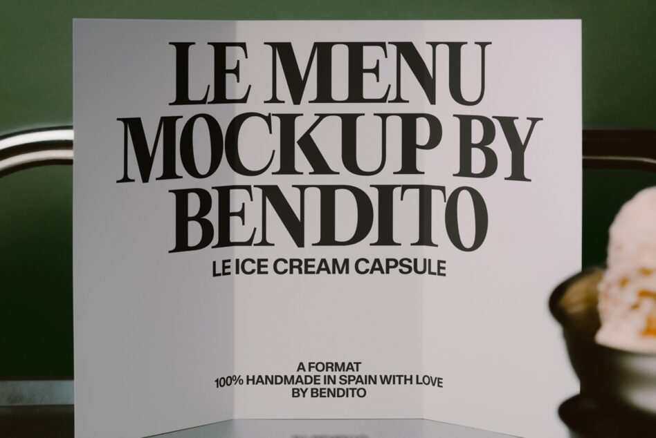 Elegant menu card mockup with bold serif typography on cream background, ice cream capsule branding by Bendito
