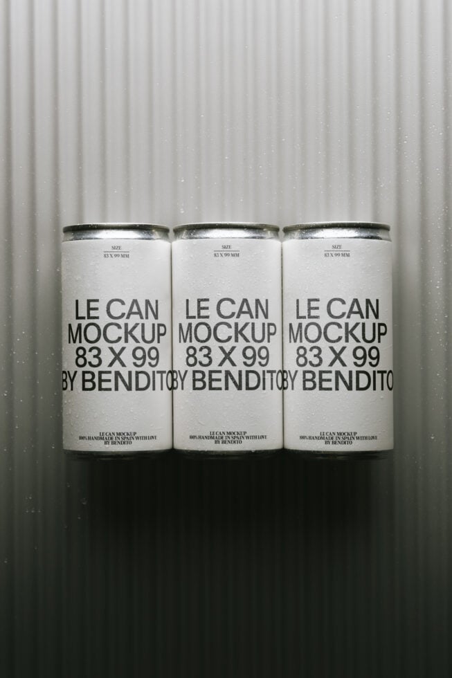 Three tall cans with metallic lids on corrugated backdrop, clean minimal branding mockup