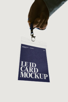 Hand holding ID badge lanyard with navy card mockup displayed