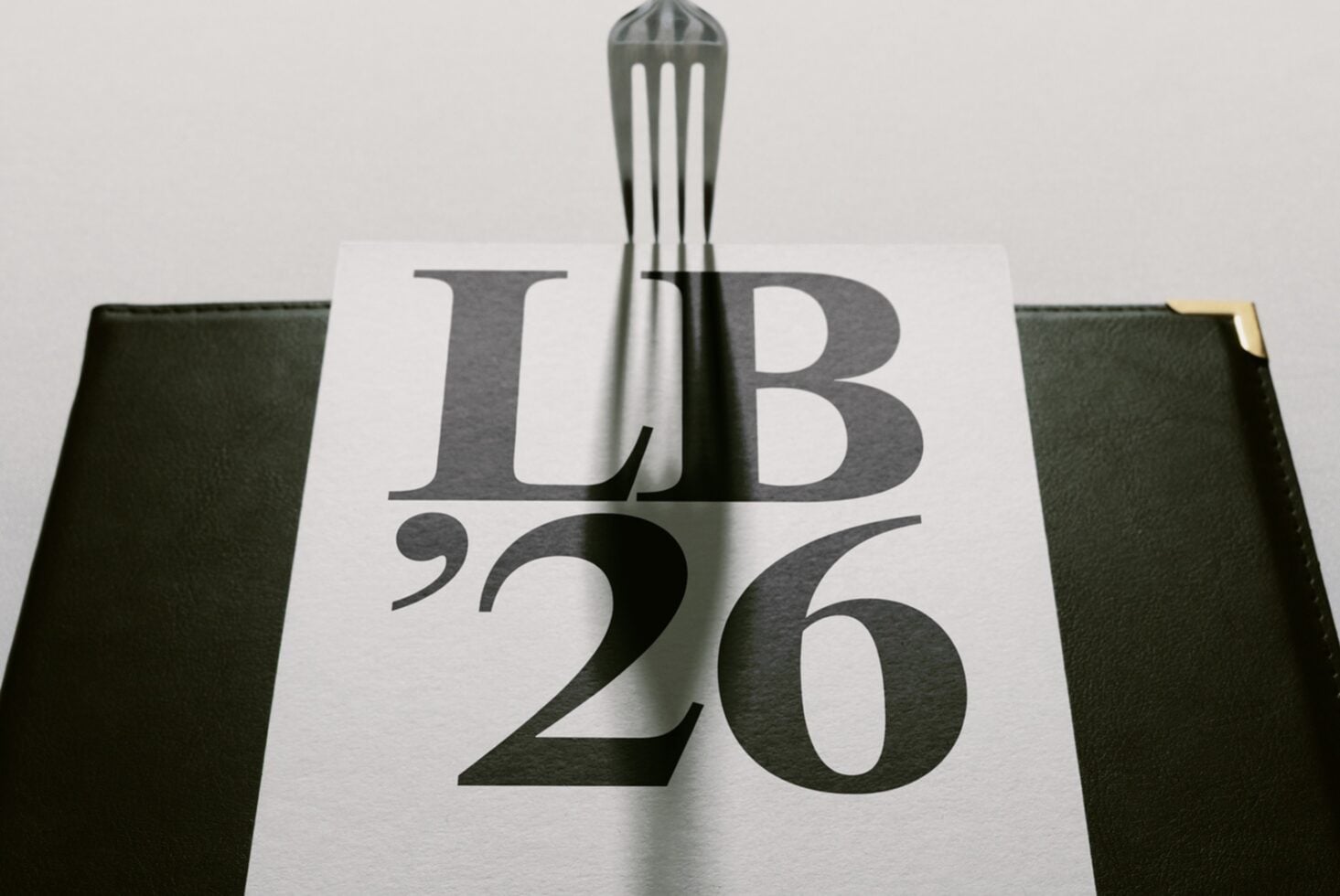 Book cover mockup with sage green linen texture, modern serif typography, brass corner detail, fork styling element