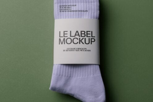 Lavender crew socks with white label band showing "LE LABEL MOCKUP" text on sage background