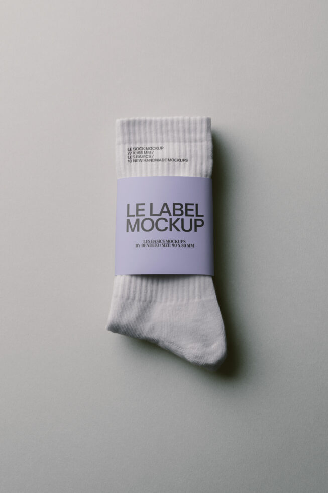 White crew socks with lavender label band mockup, 90x80mm label size, top-down view