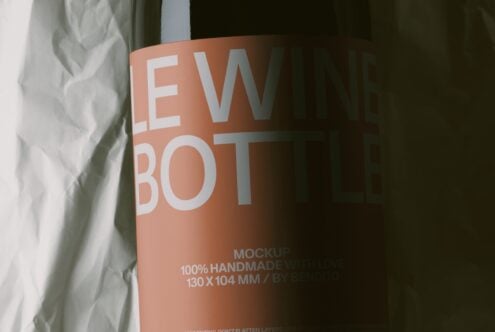 Cylindrical product mockup with terracotta finish showing new bot branding in white letters against fabric background