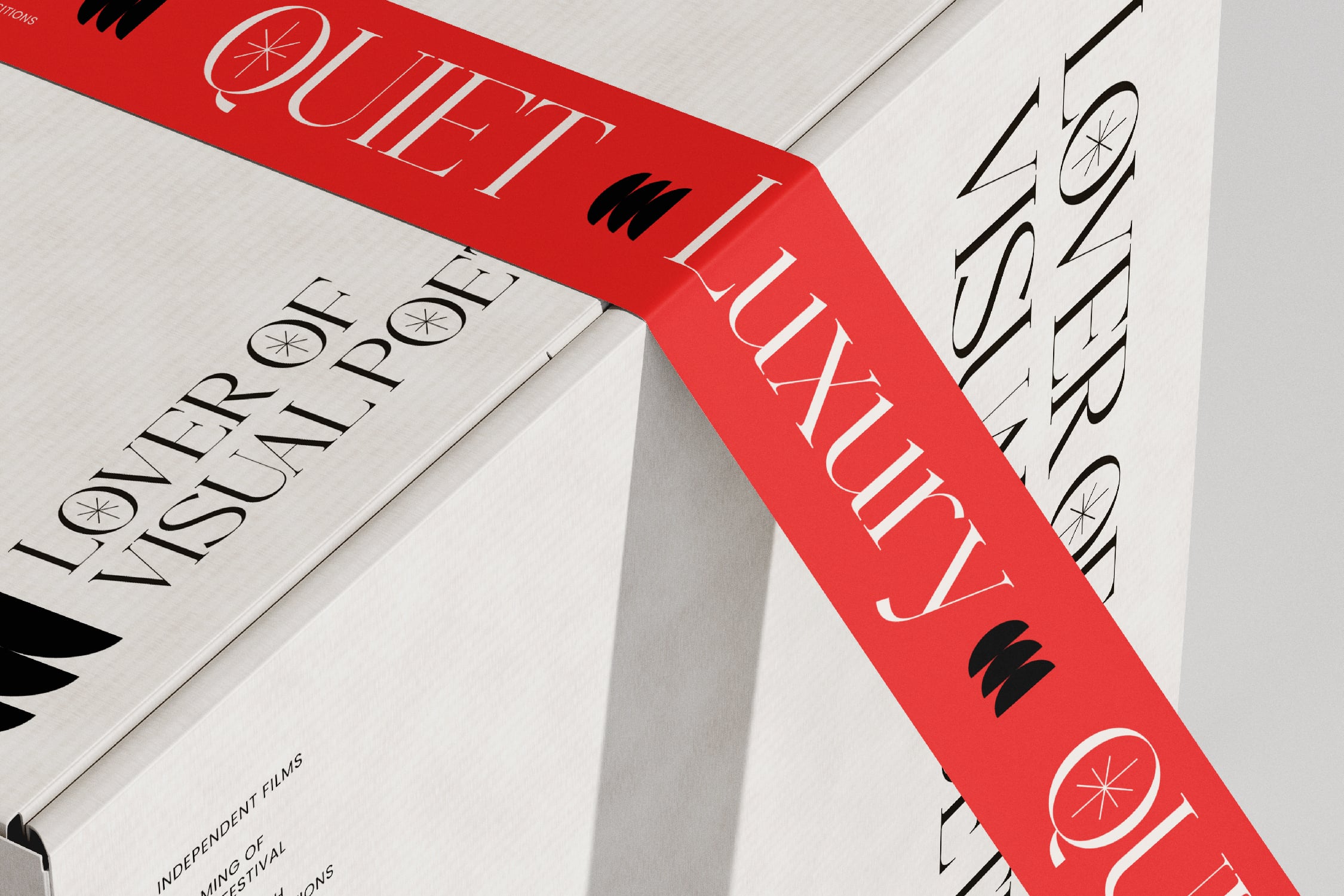Isometric shot of red book cover with bold serif type, citrus icons, black accent marks scattered across spine