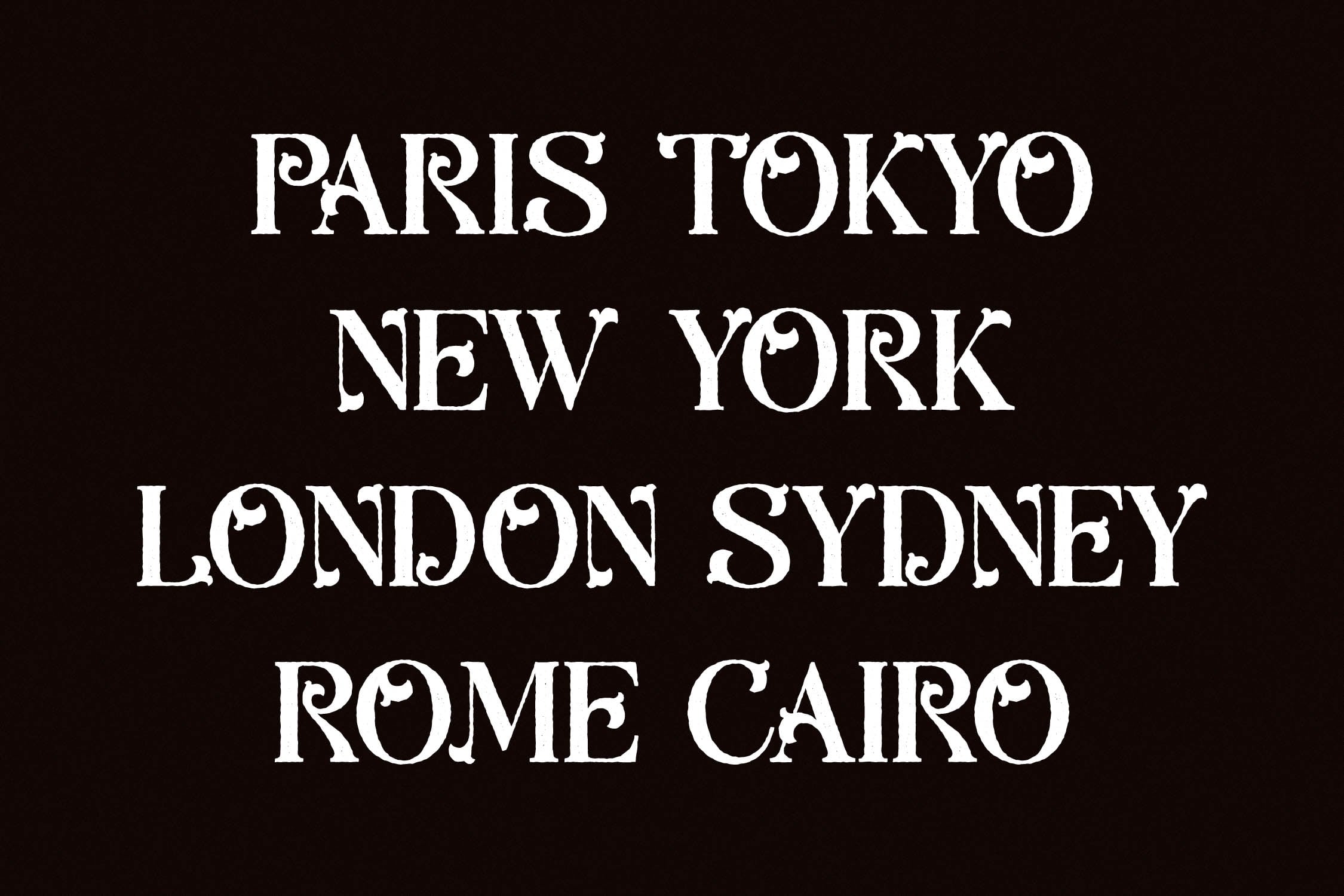 Ornate serif font displaying city names Paris Tokyo New York London Sydney Rome Cairo on black background