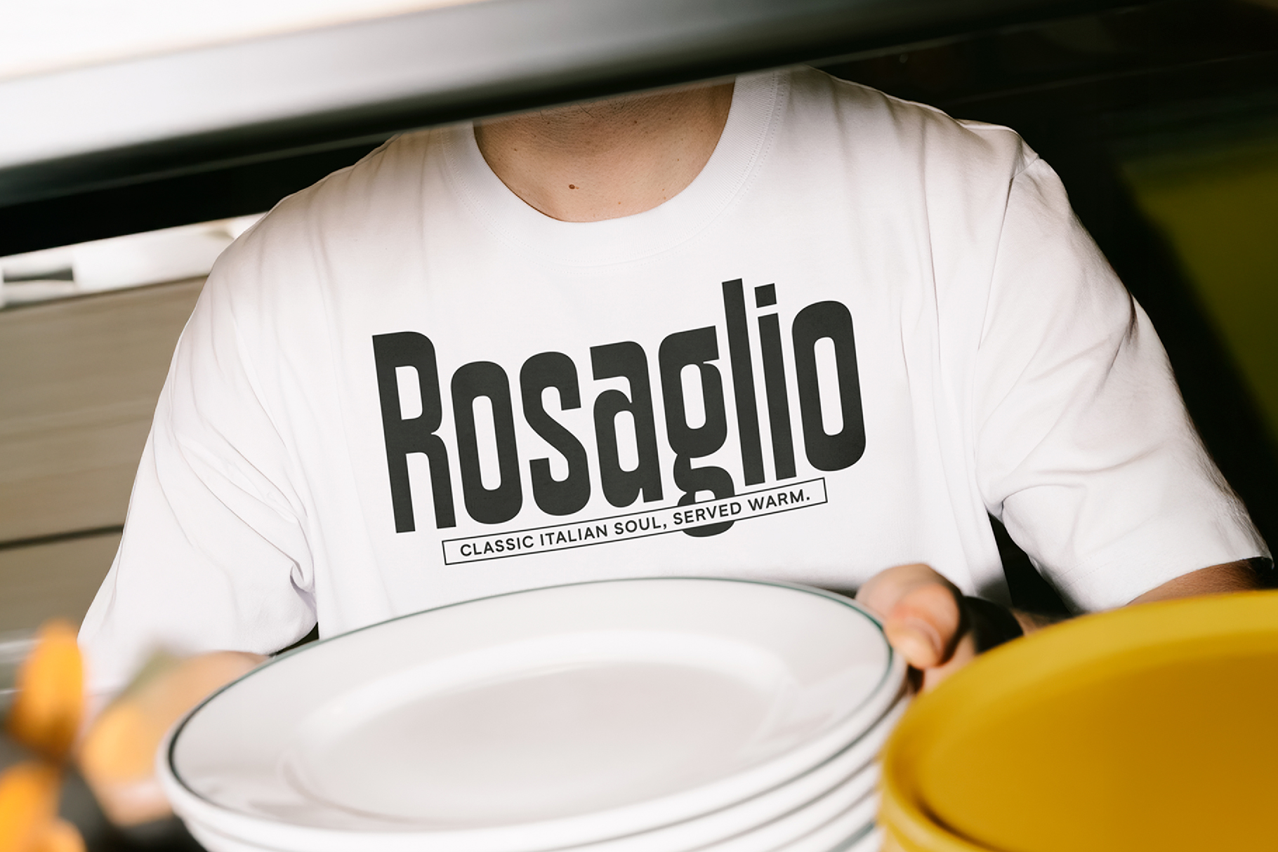 White t-shirt mockup showing bold Rosaglio typography with Italian cuisine tagline