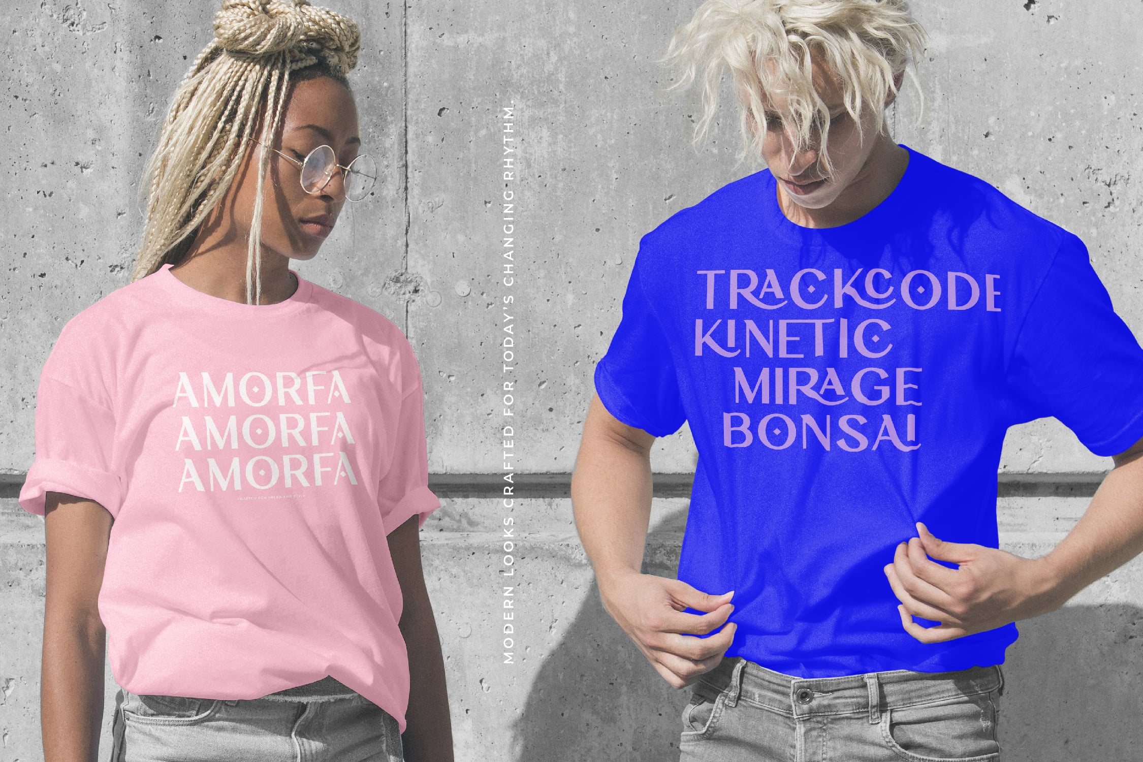 Two people wearing graphic tees against concrete wall mockup