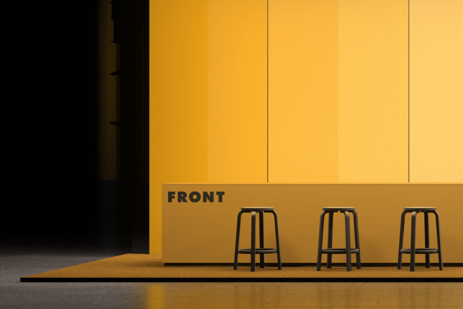 Minimalist storefront mockup with bright yellow facade, three black bar stools, concrete floor