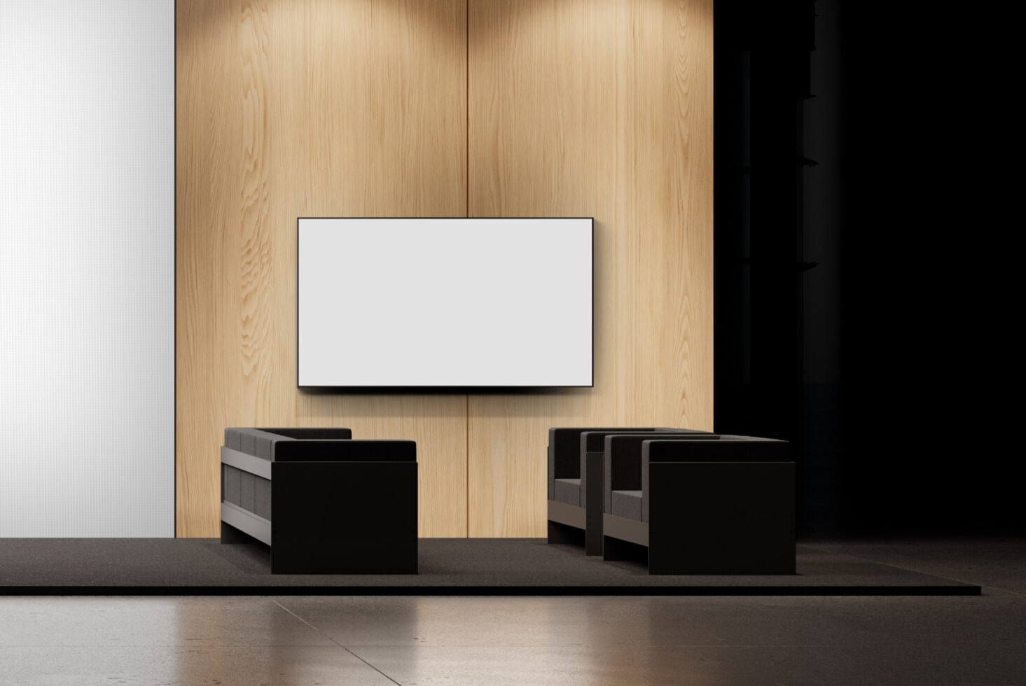Blank TV screen mounted on wooden wall above black modern seating in minimal lounge space