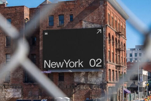 Billboard mockup on gritty NYC brick building with sunlight streaming across