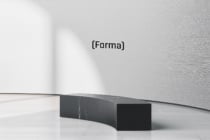 Curved black marble bench in minimal gallery space with Forma branding on wall