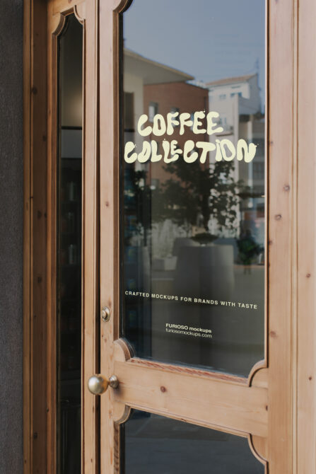 Storefront door with cream vinyl lettering reading "COFFEE COLLECTION" over urban street view