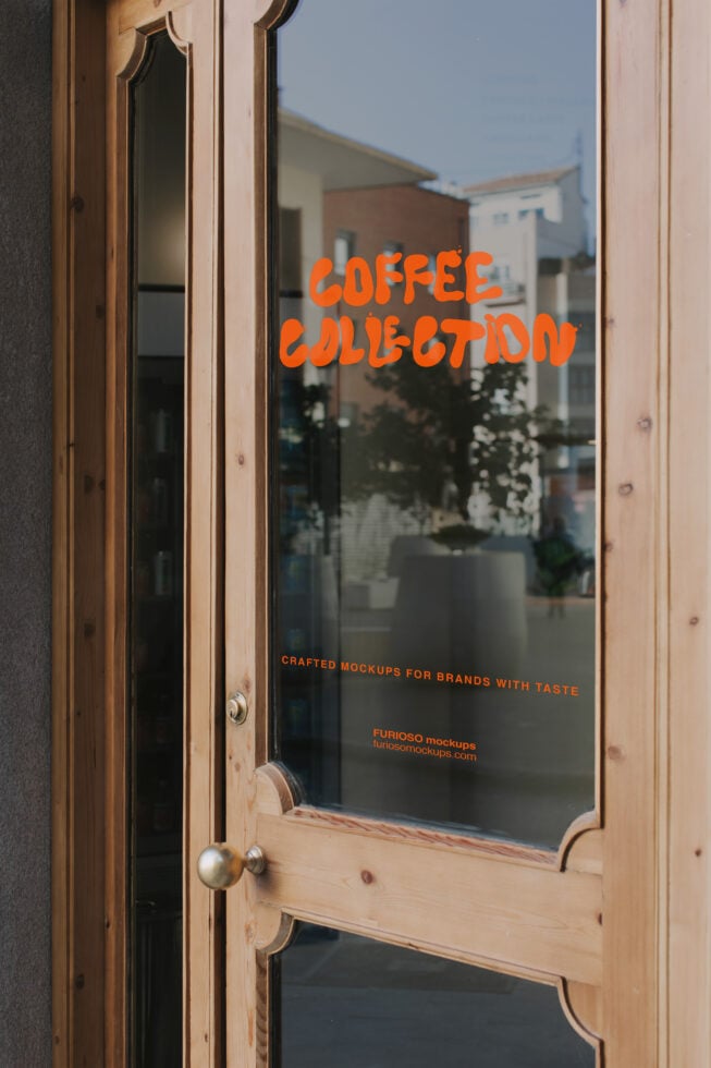 Coffee shop door mockup with bright orange text on glass window