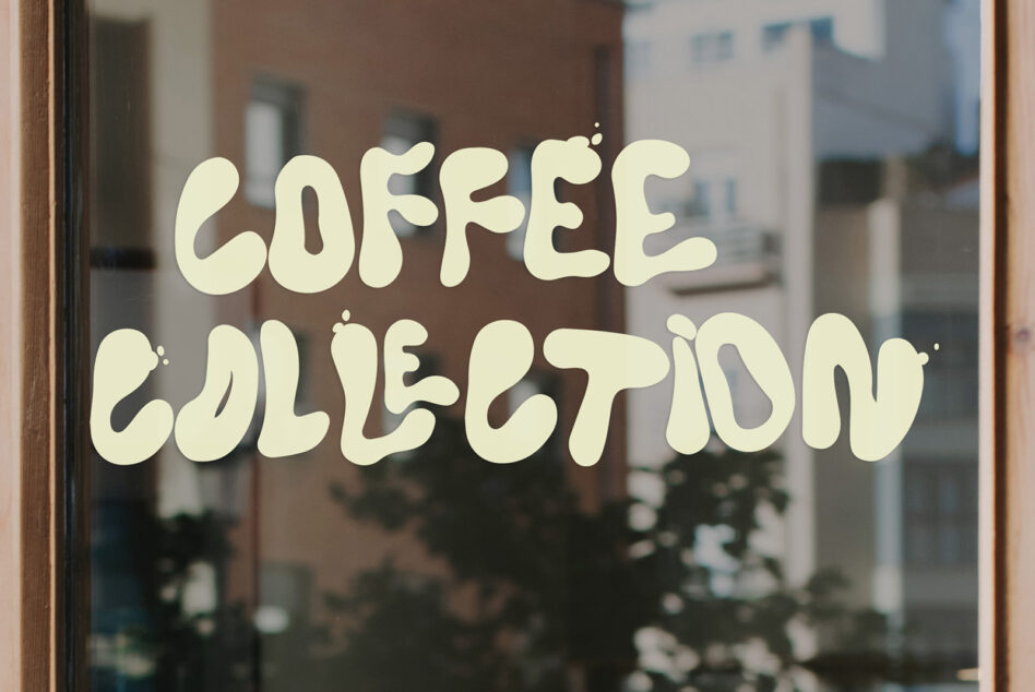 Coffee collection window decal with cream wavy lettering on glass storefront