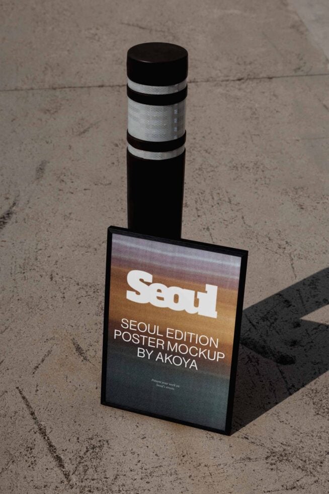 Street bollard with Seoul poster mockup leaning against concrete surface