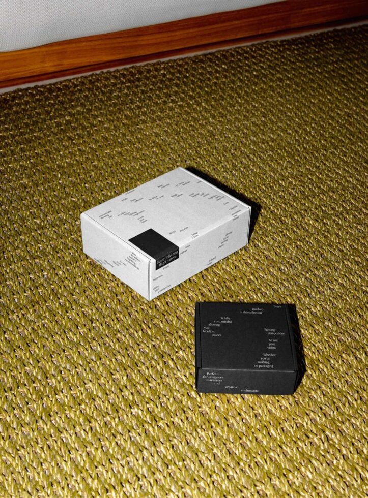 White box with black sleeve on olive green textured carpet next to wooden trim