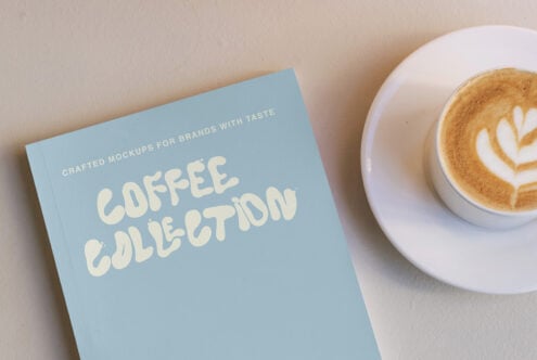 Coffee Collection mockup with blue book cover next to latte with latte art on beige surface